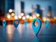 © Daria - Blue location markers symbolizing navigation and mapping concepts with a blurred city skyline and glowing lights in the background during twilight hours
