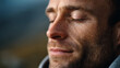 © Jane_S - Man with closed eyes smiling in contemplative outdoor moment
