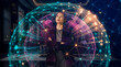 © Rendara Studio - Global digital network sphere surrounding businesswoman in corporate interior