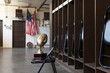 © Raymond Forbes LLC/Stocksy - Football trophy in locker room