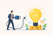 © MdToslimUddin - Businessman Plugging in a Light Bulb on Stacks of Gold Coins, Representing Investment in New Business Ideas, Startup Development, Innovation, Financial Growth, and Creative Project Success.