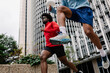 © Adrian Rodd/Stocksy - Two athletes training in the morning in Madrid's financial district.