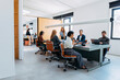 © OchreOchre/Stocksy - Professional Team Meeting In Modern Office Space