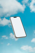 © Basil Pind/Stocksy - Smartphone floating against blue sky