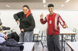 © Lupe Rodriguez/Stocksy - Students dancing together between classes at school