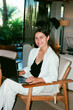 © Artem Podrez/Stocksy - Woman Business Portrait on Laptop Film Photo