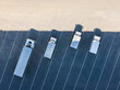 © Lawren Lu/Stocksy - Corner of Logistics Center with Parked Trucks Aerial View