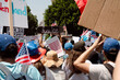 © Lindsey Rivera/Stocksy - Protesters March Holding Anti Ice Signs