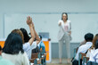 © EduLife Photos - Students Raising Hands in Classroom During Lecture