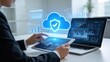 © Chloe - Cloud data security and protection concept with digital shield icon over tablet and laptop,secure storage backup and analytics for enterprise business technology