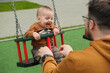 © phpetrunina14 - Father and Baby Enjoying Swing Time.