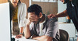 © peopleimages.com - Frustrated, businessman and team with support for mistake, project deadline or failure in office. Man, employee or stress with headache, group or colleagues for comfort, empathy or help in workplace