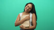 © Krakenimages.com - Woman hugs brown paper bag to chest with hands, smiling and tilting head in studio; gratitude joy warmth.