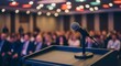 © Sakib - Microphone on podium with audience in background at conference or presentation event