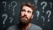 © backup_studio - Man thinking with question marks. Young caucasian adult male brainstorming problem solution or considering idea.