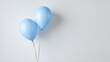 © Svetlana - Two blue balloons on a white background, ideal for baby gender reveal or celebrations related to pregnancy and family gatherings.