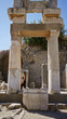 © Krakenimages.com - Young woman standing and looking up at marble ruins inside an open ancient building in ephesus, turkey; history awe.