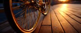 The bicycle wheels rest on a wooden porch bathed in cozy golden glow