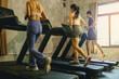 © Panumas - Fit peoples workout jogging in machine treadmill at fitness gym. Selected focus