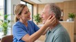 © xuxu - Woman audiologist fitting a hearing aid to an elderly man. Happy senior patient with assisted listening device. Healthcare for hearing loss.