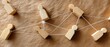 © pvl0707 - Wooden human figures connected by strings create a visual of teamwork and communication in a network setting