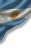 © Valeri - The flag of Argentina features horizontal stripes of blue and white with a sun emblem in the center. The fabric flows gently, reflecting light and showing the colors clearly.