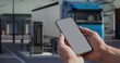© ivanbaranov - A man checking data on a tablet while semi electric truck is charging