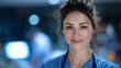 © D.Y.Motion - A young Caucasian woman with brown hair smiles in a medical setting. She wears scrubs and a stethoscope around her neck, exuding professionalism and care.