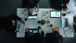 © InfiniteFlow - Top down aerial view of smart businessman explain financial graph to investor while business team analysis stock market investment chart at meeting table. Diverse group brainstorm idea. Directorate.
