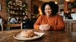 © Nina - Plus-size woman enjoying a donut with a cozy atmosphere in a café