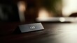 © KASUEMA SALAE - Close up photography of a CEO nameplate on a luxury dark wood desk, blurred background of a high-end office, leadership concept