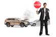 © Ljupco Smokovski - Businessman in a torn suit holding a stop sign after a car