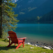 © Rachel - Red chair by a peaceful mountain lake, perfect for vacation, solitude, nature retreat, and relaxation or retirement content