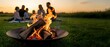 © Yuliia - Friends gathering around outdoor fire pit during golden hour sunset creating warm social atmosphere for backyard entertainment and relaxation.