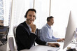 © fizkes - Productive telework. Happy middle aged man in headset fintech customer advisor digital trading analyst call center agency team member look at camera with confident smile distracted from computer work