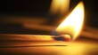 © Akanei - wick. A matchstick ignites a candle wick, creating a warm flame in a dark setting. symbolizing life milestones and joyful moments, STEM education sheets, designed for biotech research communications.