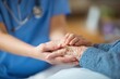 © IRINA - Elderly hand shaking with a healthcare professional's hand in a bright medical environment, symbolizing trust and care in patient-doctor relationships