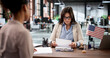 © Andrey Popov - African American Immigrant Attorney Meets Client