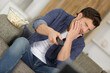 © auremar - bored man changing tv channels at home