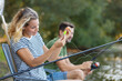 © auremar - beautiful couple catching fish in the pond