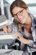 © auremar - happy woman working with printing equipment