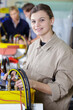 © auremar - female apprentice working in electronic factory