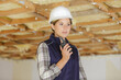 © auremar - woman wearing a safety hat holding a radio walkie talkie