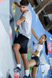 © auremar - young couple doing wall climbing