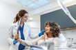© Graphicroyalty - Patient looking at results in mirror. Facial treatment, Healthcare And Medicine concept. Attractive smiling woman in clinic chair with female doctor in white coat. Professional aesthetic medical care.