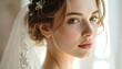 © rebung - Close-up of a bride with veil, looking pensively at camera, natural light