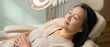 © Fernando - Senior Asian woman relaxing in dental chair with eyes closed, serene expression, receiving gentle care and treatment in a modern clinic Concept of healthcare, wellness, and patient comfort