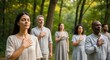 © Tanakorn - Diverse group practices mindful connection at a serene outdoor wellness retreat, fostering inner peace and spiritual growth
