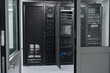 © .shock - Data center server racks with open cabinet showing network equipment and storage hardware