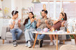© Pixel-Shot - Happy family in bunny ears with painted eggs sitting at home on Easter Day